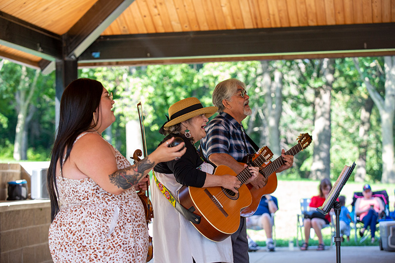 Musical group performing outside.