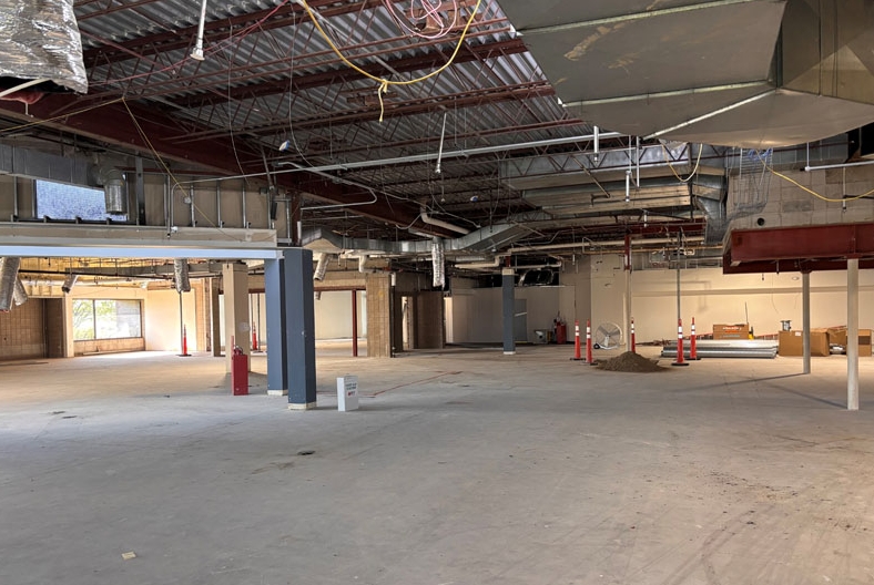 Demolition of Burnhaven Library, showing space with all walls, flooring and ceiling tore out.