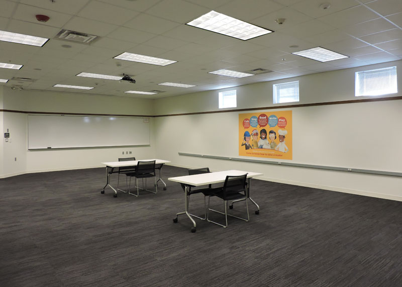 Farmington Large Meeting Room with two tables and four chairs set up.