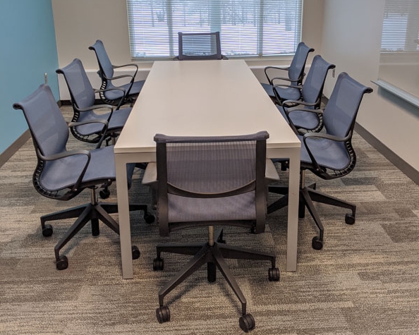 Heritage Conference Room (8-person) with table and eight chairs.