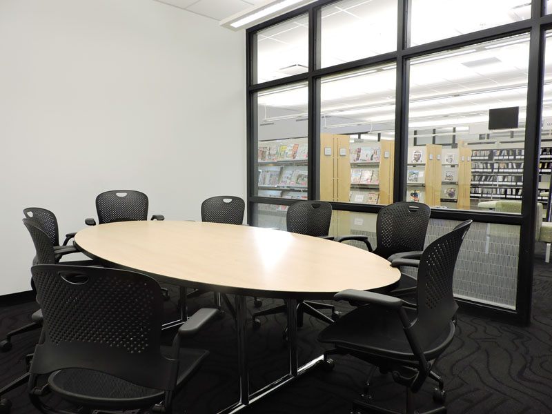 Robert Trail Conference Room with table and eight chairs.
