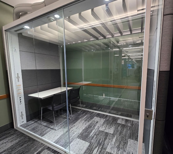 Wescott Study Pod 1 with table on the left with two chairs. 