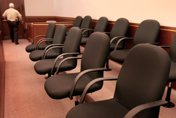 A row of chairs in the jury box. 