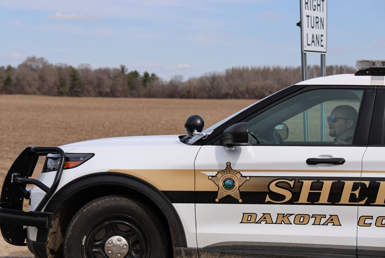 A deputy in a patrol car.
