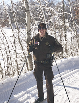 Park Ranger on a cross-country ski trail in the winter.