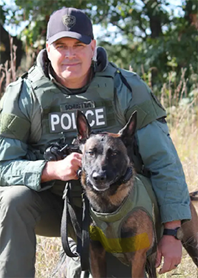 Sergeant Schuster with canine partner Zeus.