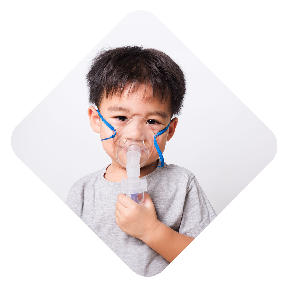 Boy with asthma holding inhaler.