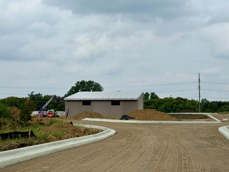 A picture of the Recycling Zone Plus driveway and curb