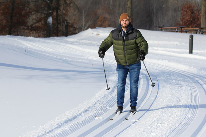 A man cross-country skiing.