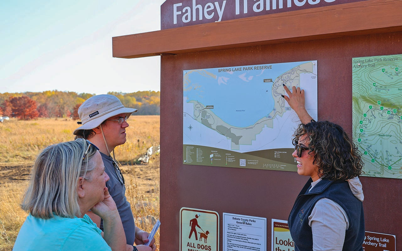 Group of people at Fahey Trailhead kiosk.