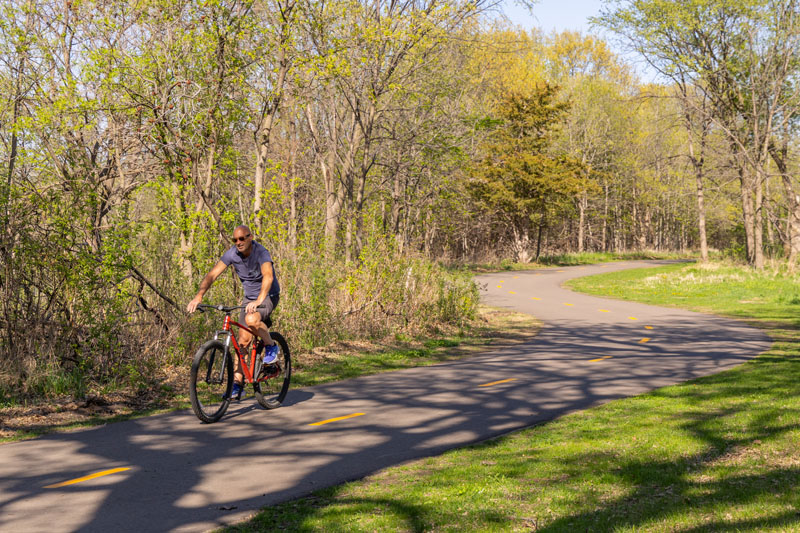 A biker on Vermillion River Greenway.