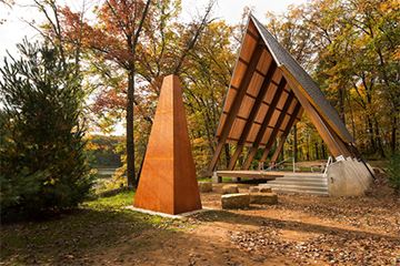 An a-frame style shelter in the woods