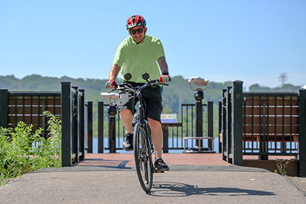 Biker riding on the Minnesota River Greenway.